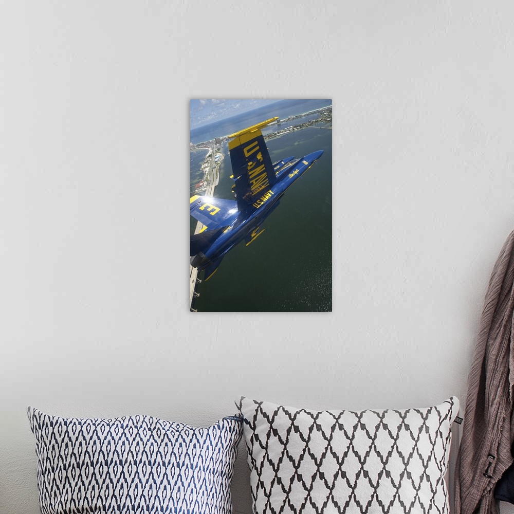 A bohemian room featuring An F/A-18 Hornet of the Blue Angels over Pensacola Beach, Florida.