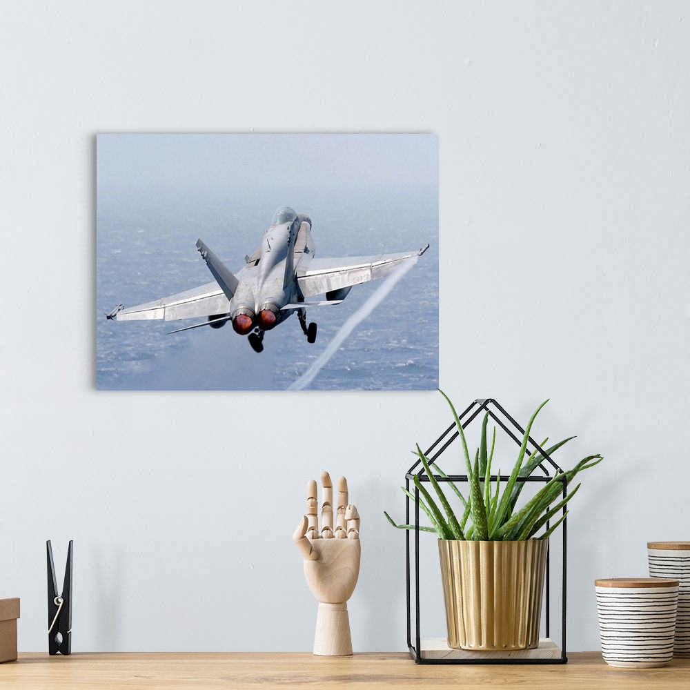 A bohemian room featuring An F/A-18 Hornet taking off.