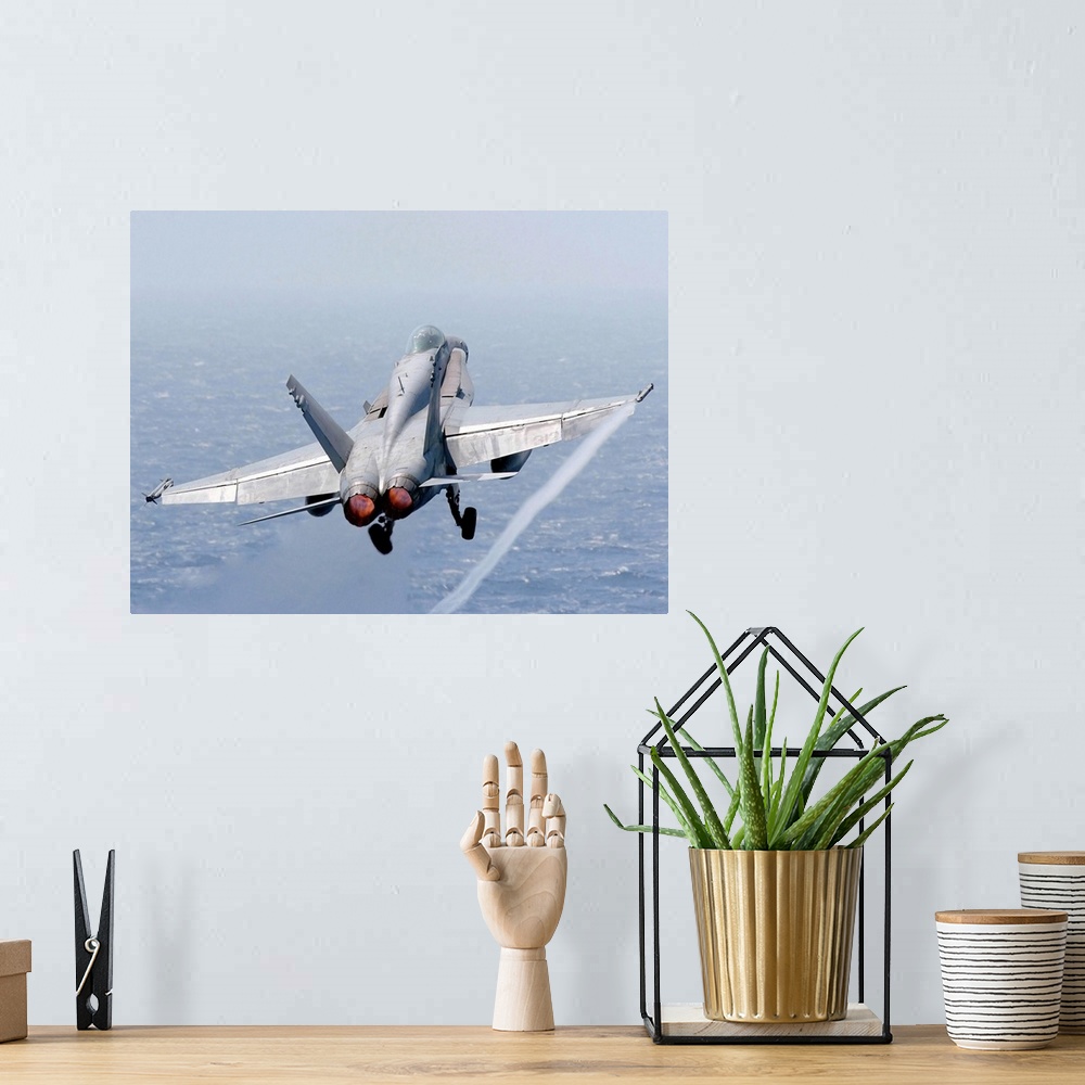 A bohemian room featuring An F/A-18 Hornet taking off.