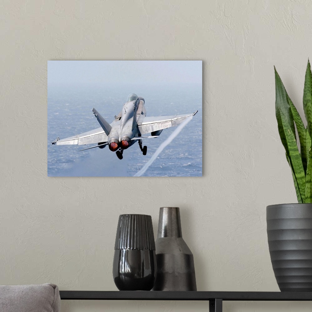 A modern room featuring An F/A-18 Hornet taking off.