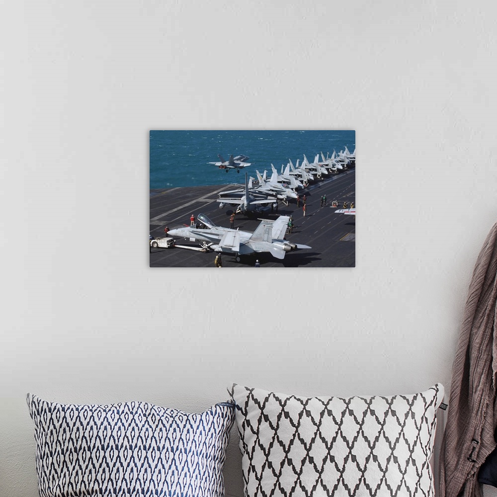A bohemian room featuring An F/A-18C Hornet launches from the flight deck aboard USS Theodore Roosevelt.