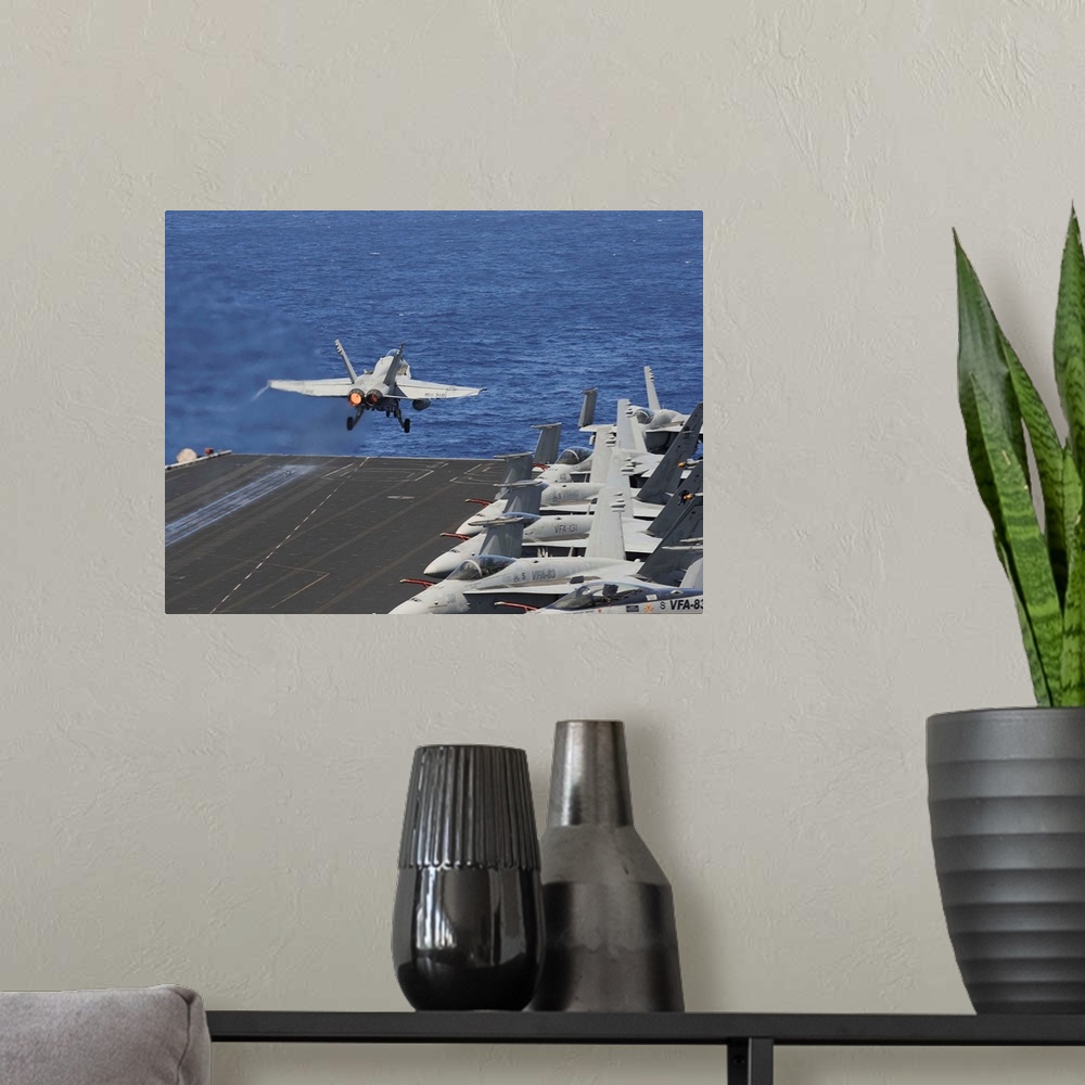 A modern room featuring North Arabian Sea, June 5, 2013 - An F/A-18C Hornet launches off the flight deck of the aircraft ...