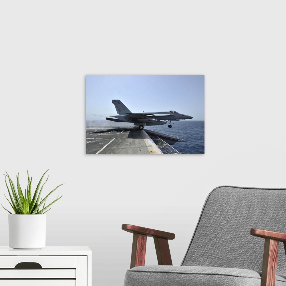 A modern room featuring Arabian Sea, March 28, 2011 - An F/A-18E Super Hornet launches from the aircraft carrier USS Ente...