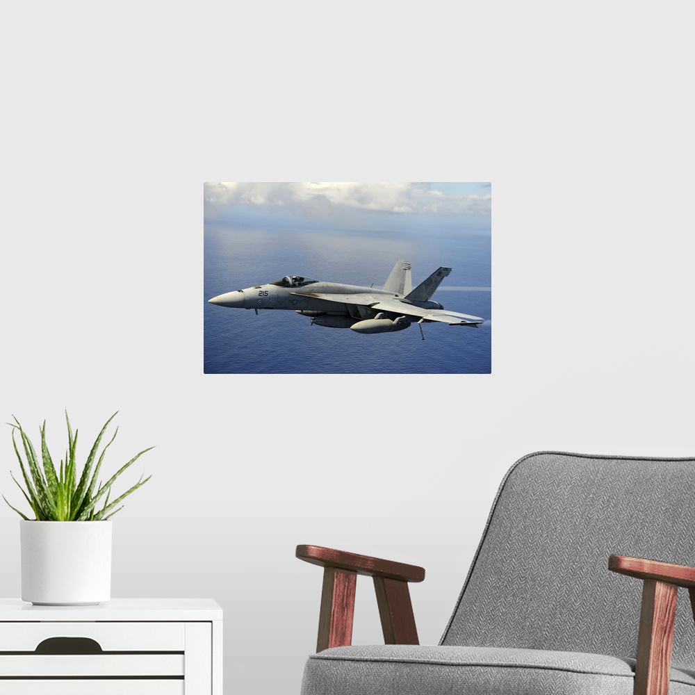 A modern room featuring April 24, 2013 - An F/A-18E Super Hornet participates in an air power demonstration over the Paci...