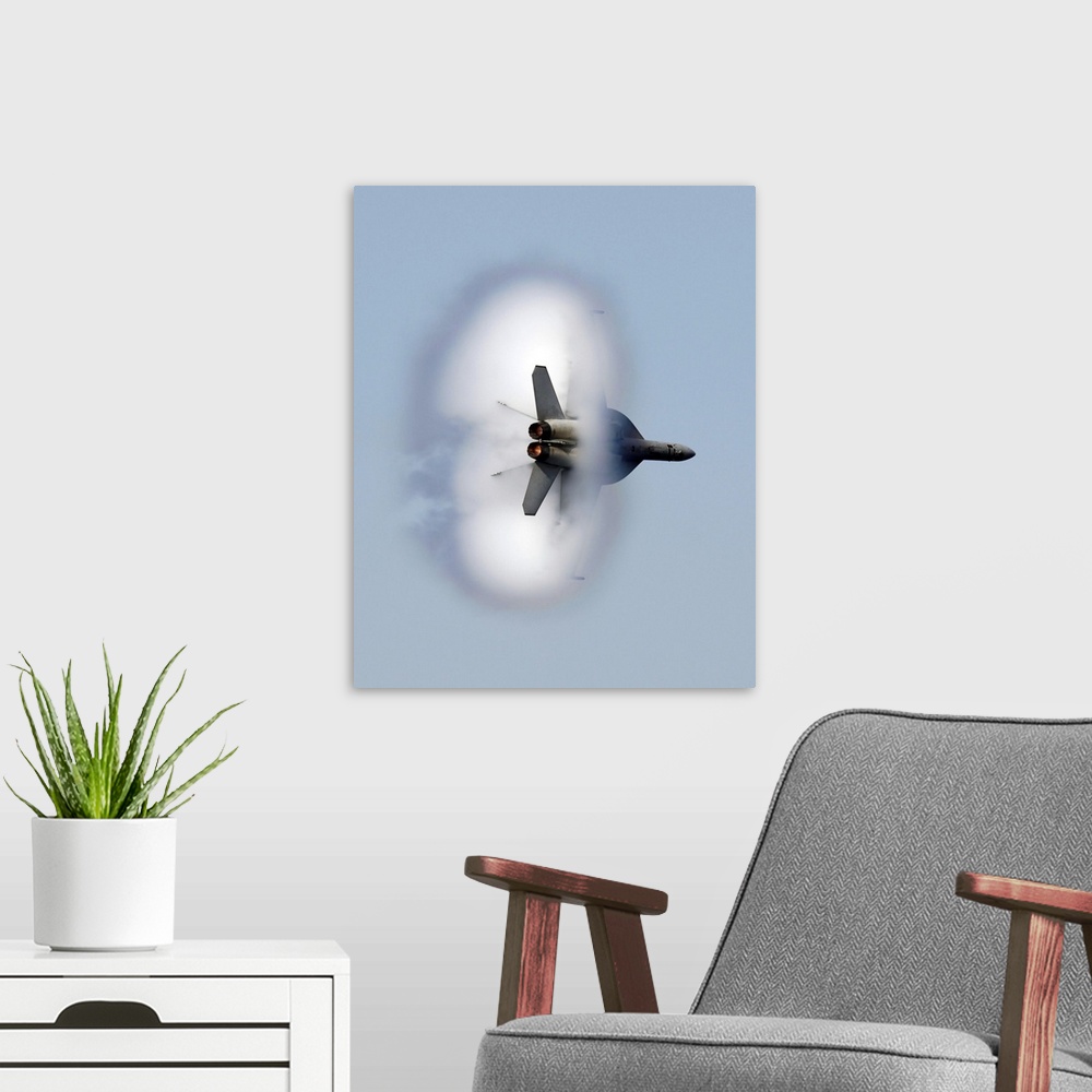 A modern room featuring A large piece of artwork that has a jet flying through a cloud of smoke.