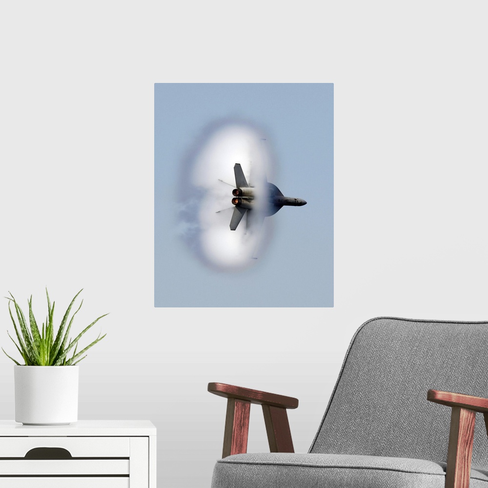 A modern room featuring A large piece of artwork that has a jet flying through a cloud of smoke.