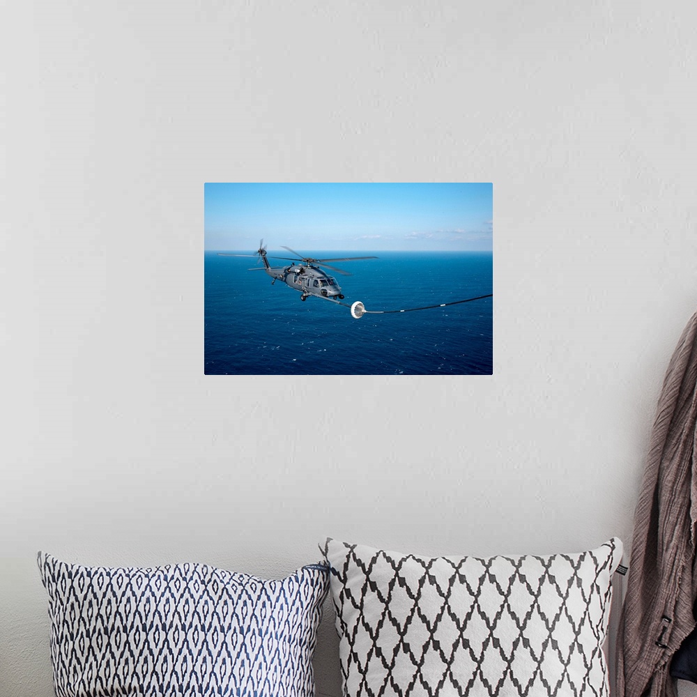 A bohemian room featuring Pacific Ocean, March 18, 2011 - An MC-130P Combat Shadow refuels a HH-60 Pave Hawk helicopter. Th...