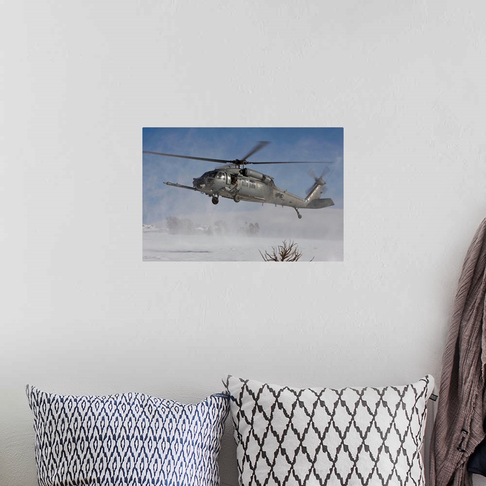 A bohemian room featuring An HH-60G Pave Hawk from the 512th RQS fly's low over a landing zone during a training mission ou...