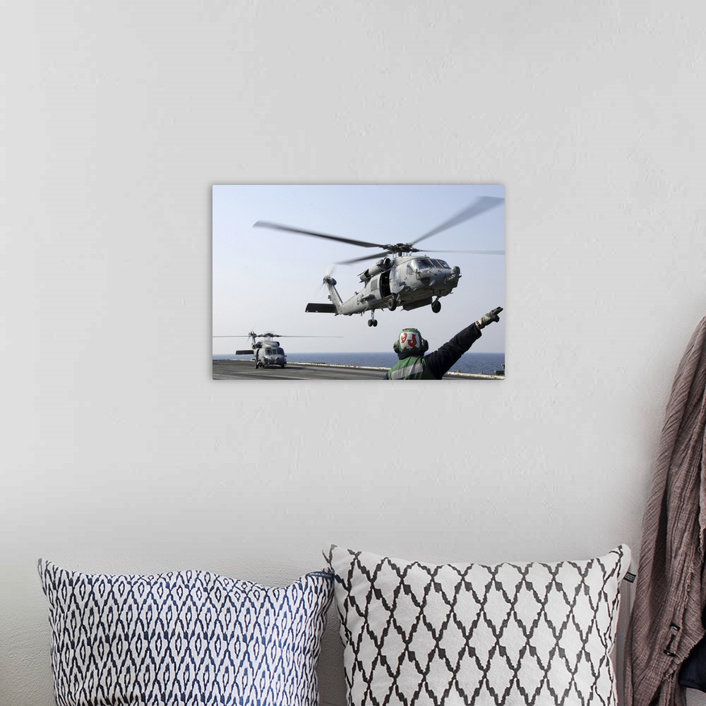 A bohemian room featuring Pacific Ocean, March. 13, 2011 - An HH-60H Sea Hawk helicopter launches from the aircraft carrier...