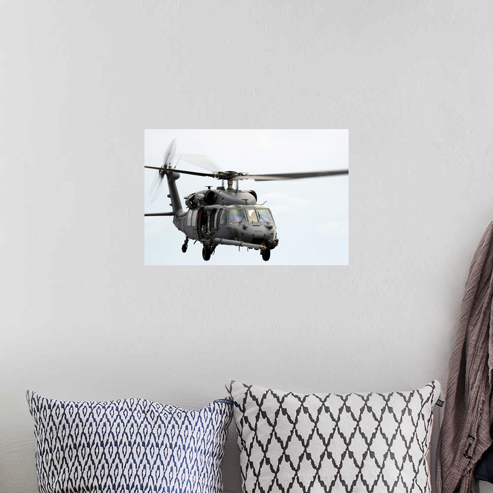 A bohemian room featuring An HH60 Pave Hawk helicopter conducts search and rescue operations