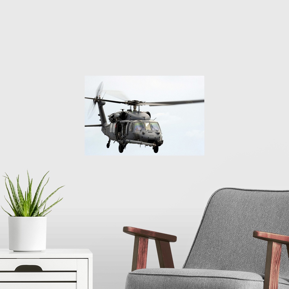A modern room featuring An HH60 Pave Hawk helicopter conducts search and rescue operations