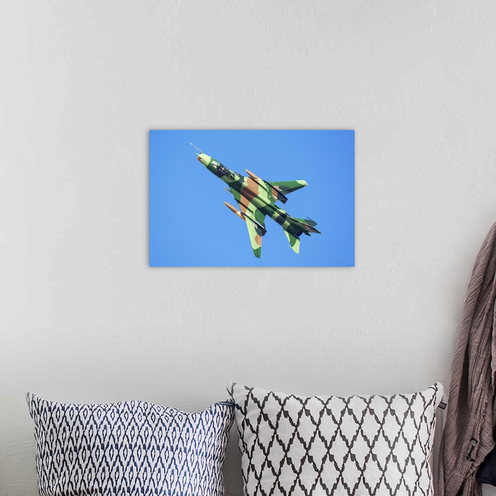 A bohemian room featuring An Islamic Revolutionary Guard Corps (IRGC) Sukhoi Su-22 fighter jet.