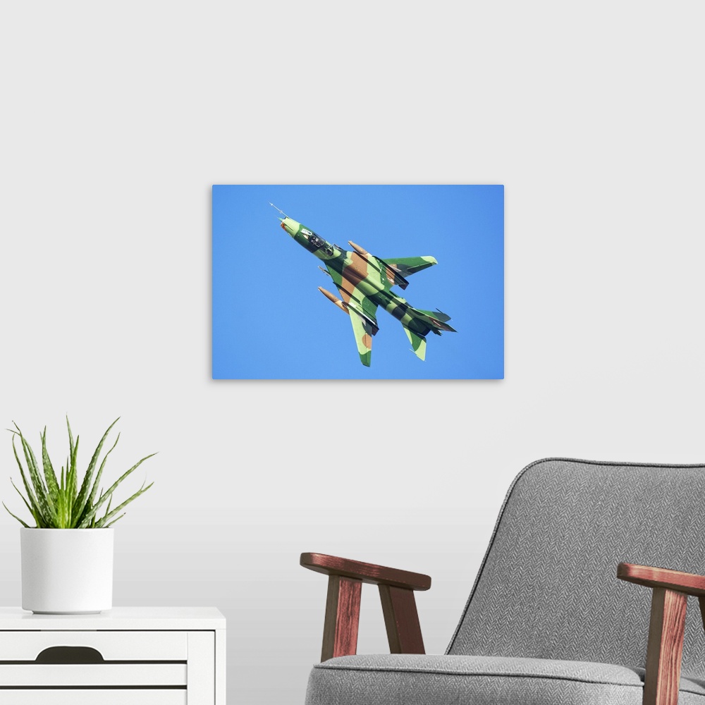A modern room featuring An Islamic Revolutionary Guard Corps (IRGC) Sukhoi Su-22 fighter jet.