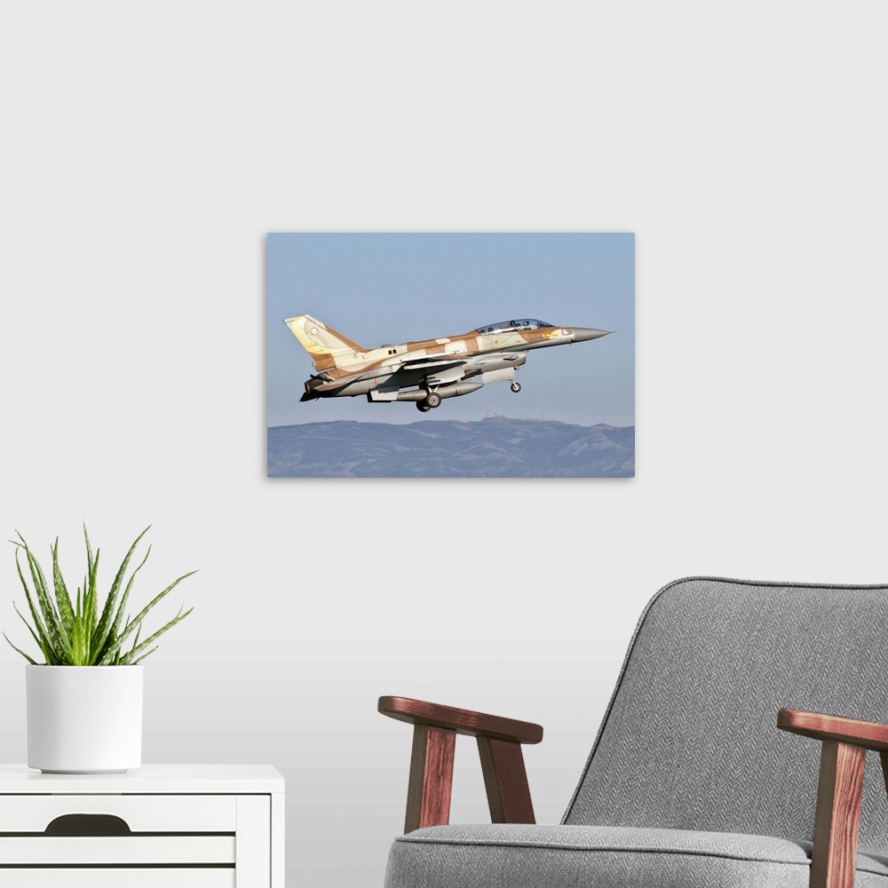 A modern room featuring An Israeli Air Force F-16I Sufa takes off from Decimomannu Air Base, Sardinia, Italy, during Exer...