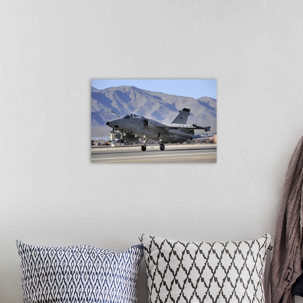 A bohemian room featuring An Italian Air Force AMX fighter landing at Nellis Air Force Base in Nevada.