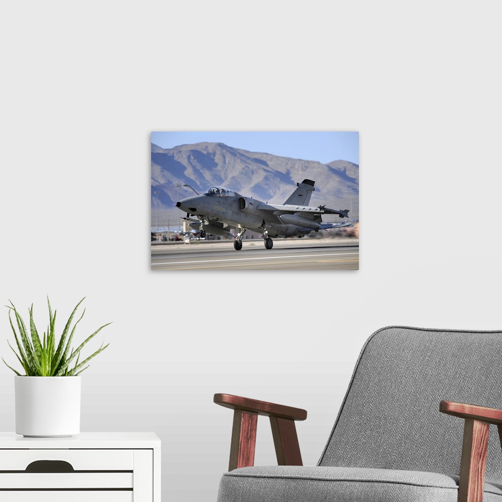 A modern room featuring An Italian Air Force AMX fighter landing at Nellis Air Force Base in Nevada.