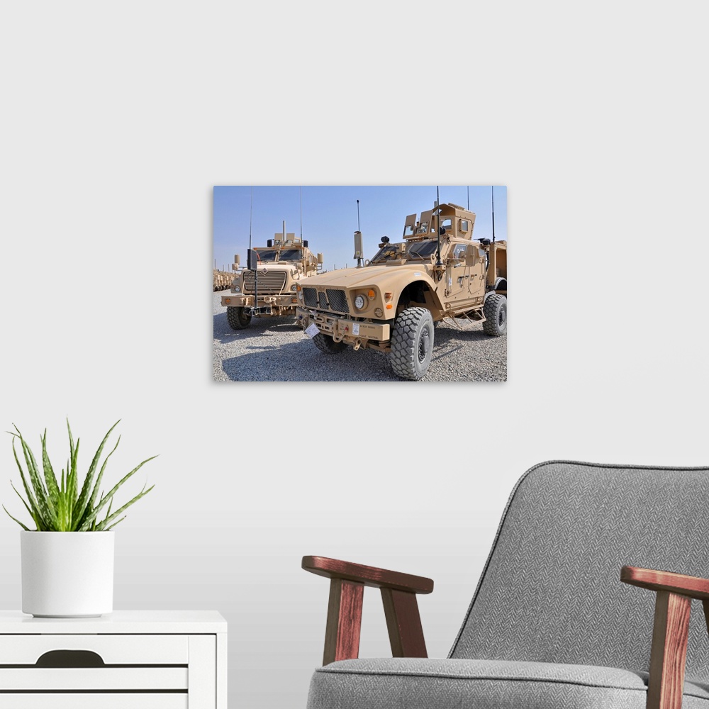 A modern room featuring October 22, 2009 - A Mine Resistant Ambush Protected all-terrain vehicle (M-ATV), right, is parke...