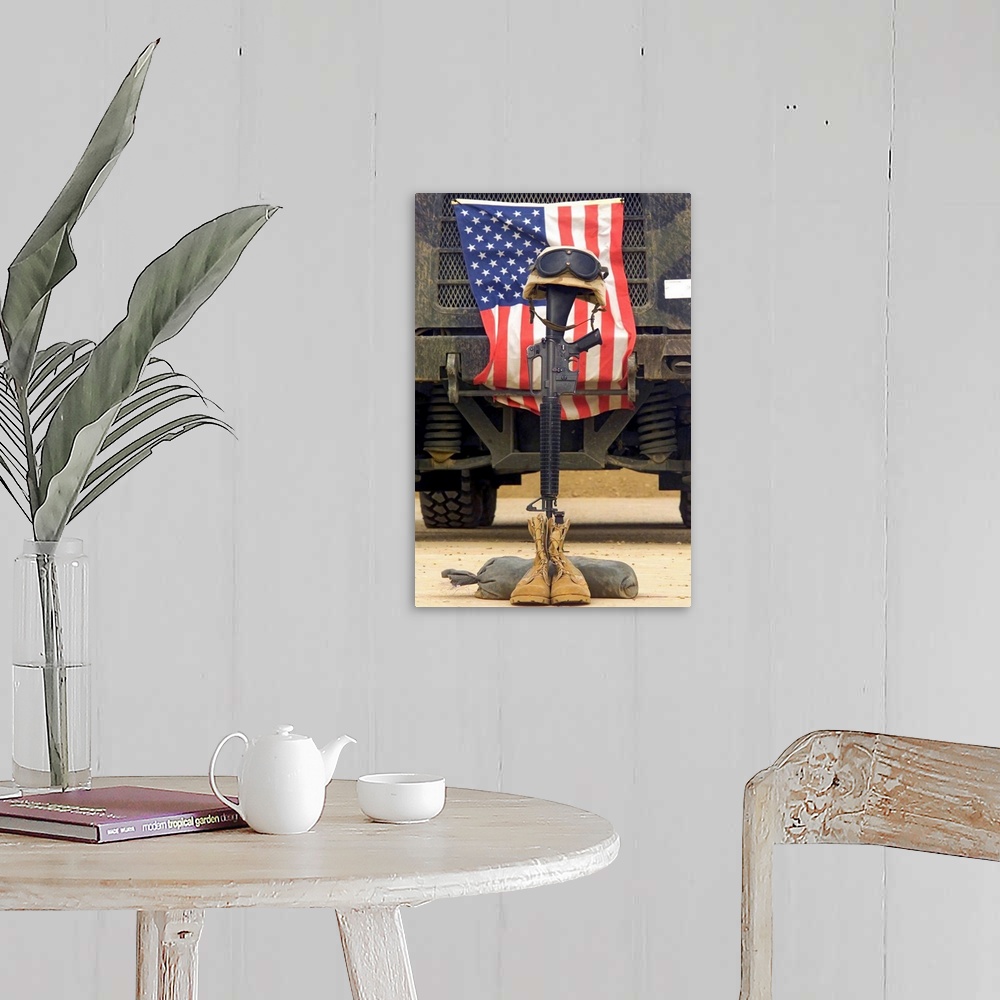 A farmhouse room featuring Tall photo on canvas of a rifle sticking out of two boots with a helmet on top in front of an Ame...