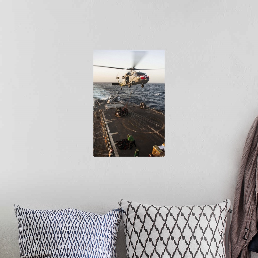 A bohemian room featuring February 16, 2013 - An MH-60S Sea Hawk helicopter delivers cargo to the Ticonderoga-class guided-...
