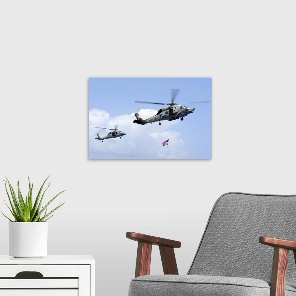 A modern room featuring Pacific Ocean, April 20, 2013 - An MH-60S Sea Hawk helicopter follows behind an MH-60R Sea Hawk h...