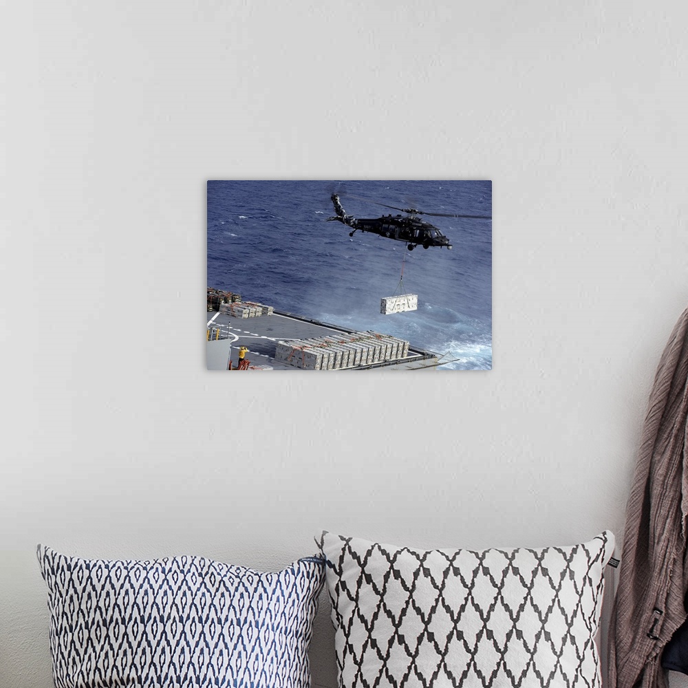 A bohemian room featuring Atlantic Ocean, January 15, 2013 - An MH-60S Sea Hawk helicopter picks up ammunition from the Mil...