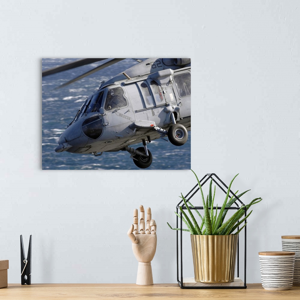 A bohemian room featuring An MH-60S Seahawk helicopter.