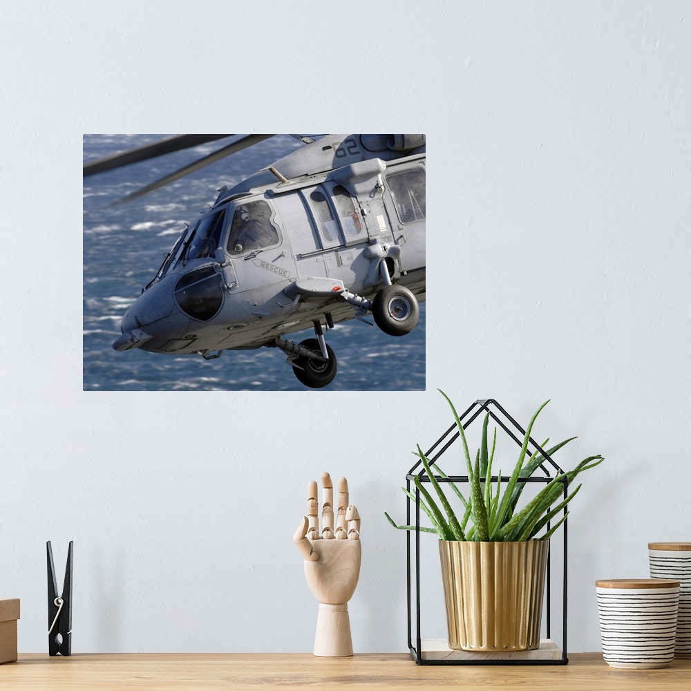 A bohemian room featuring An MH-60S Seahawk helicopter.