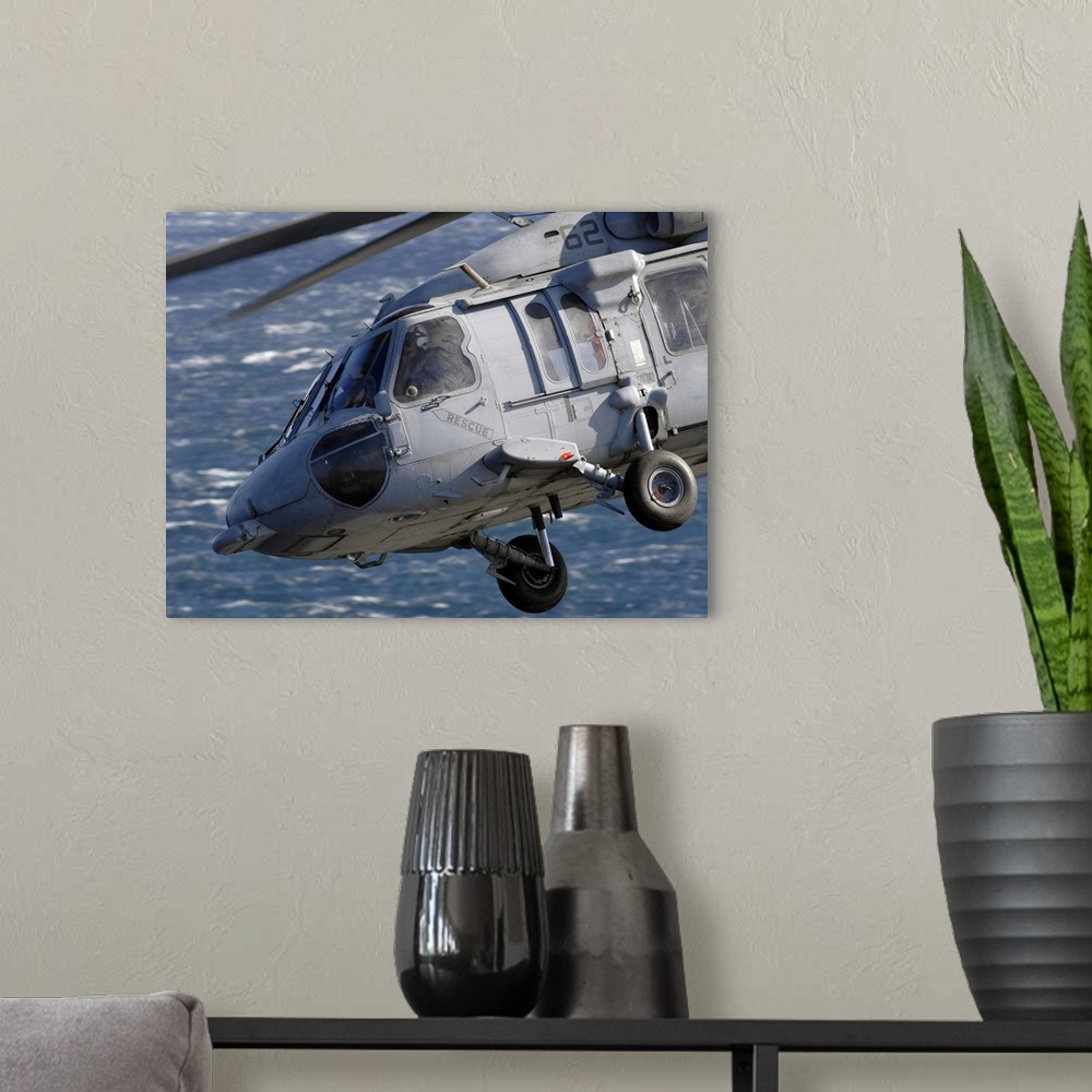 A modern room featuring An MH-60S Seahawk helicopter.