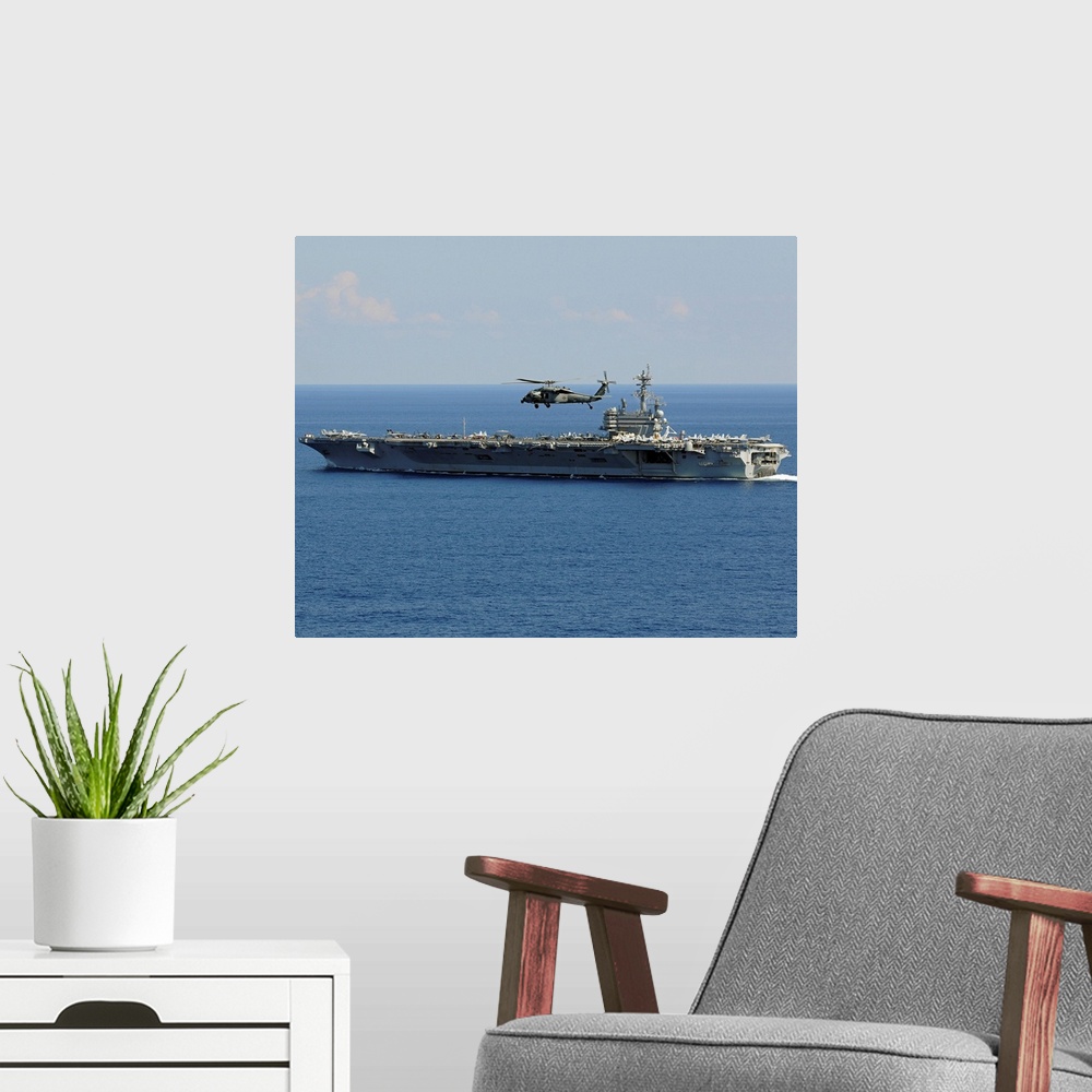 A modern room featuring Atlantic Ocean, October 10, 2010 - An MH-60S Seahawk helicopter flies over the aircraft carrier U...