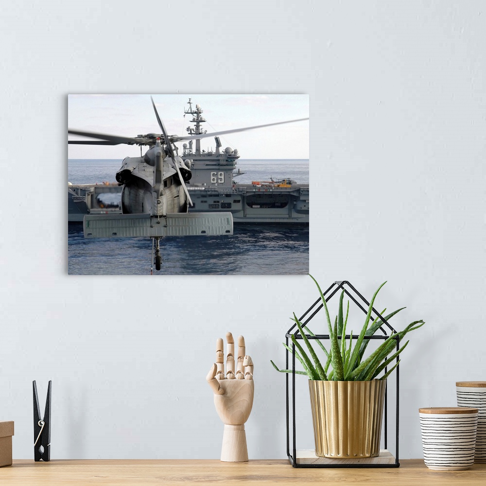 A bohemian room featuring Atlantic Ocean, November 5, 2005 - An MH-60S Seahawk helicopter hovers prior to taking a load of ...