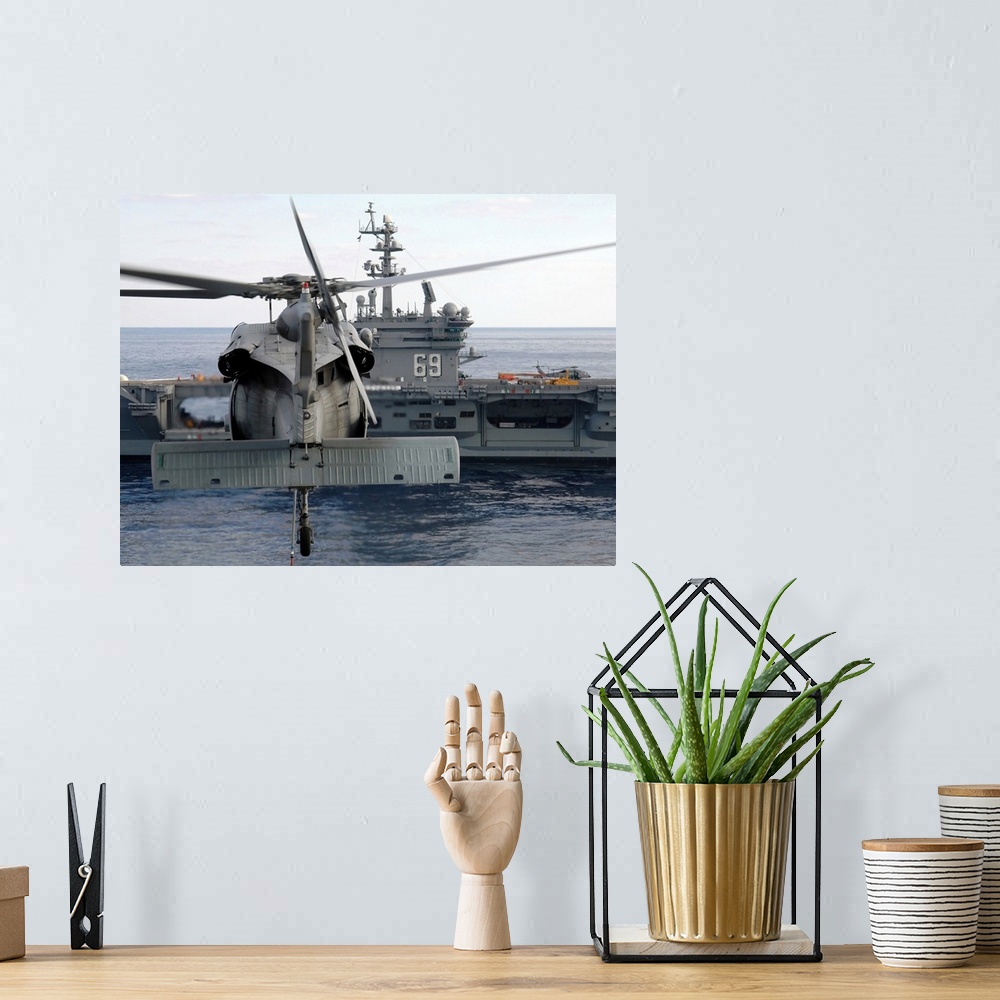 A bohemian room featuring Atlantic Ocean, November 5, 2005 - An MH-60S Seahawk helicopter hovers prior to taking a load of ...
