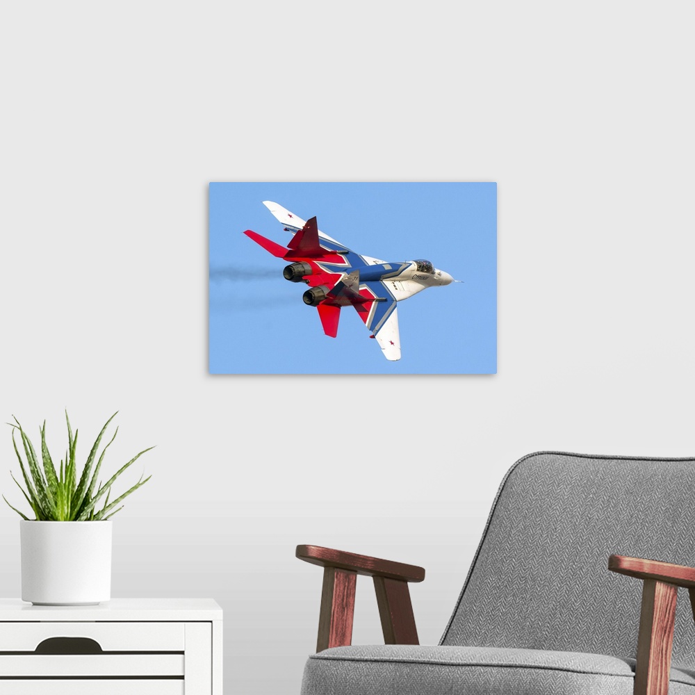 A modern room featuring An MiG-29 of the Russian acrobatic team Strizhi.