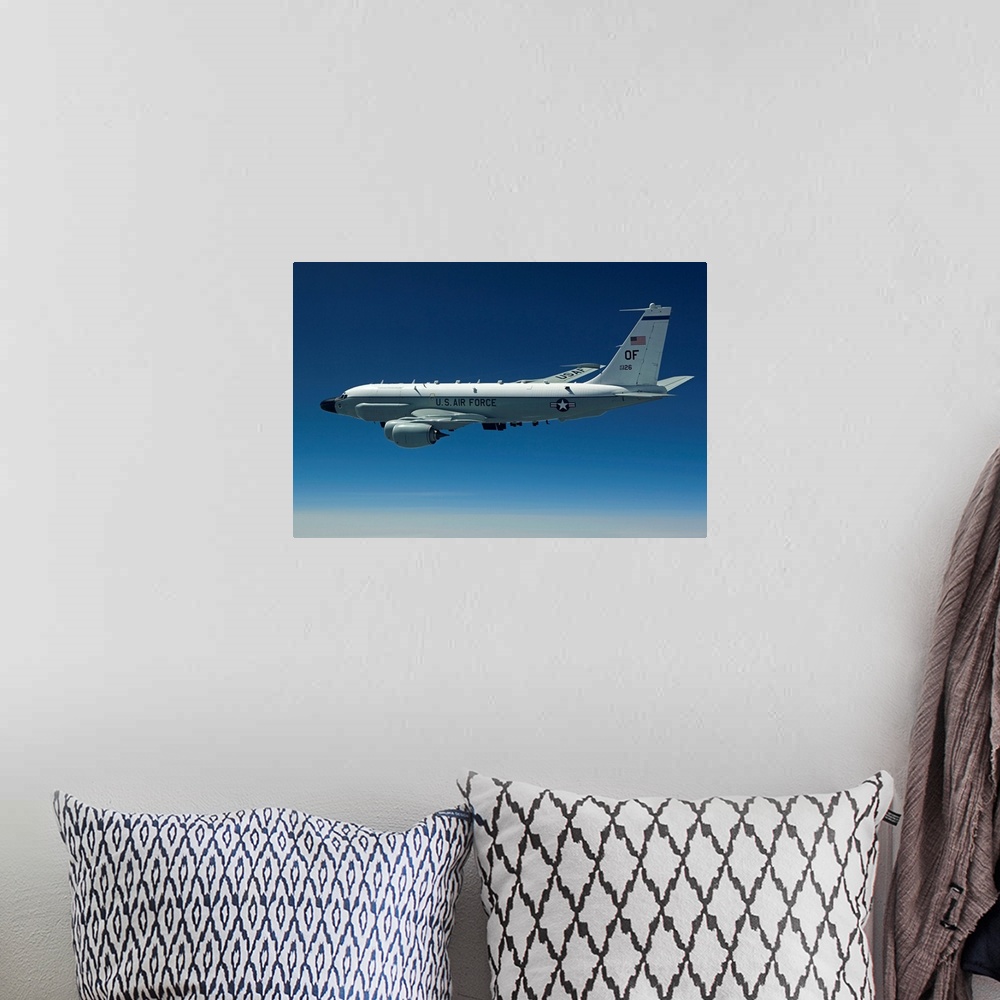 A bohemian room featuring An RC-135W Rivet Joint aircraft flies high over the Midwest on a training mission out of Offutt A...