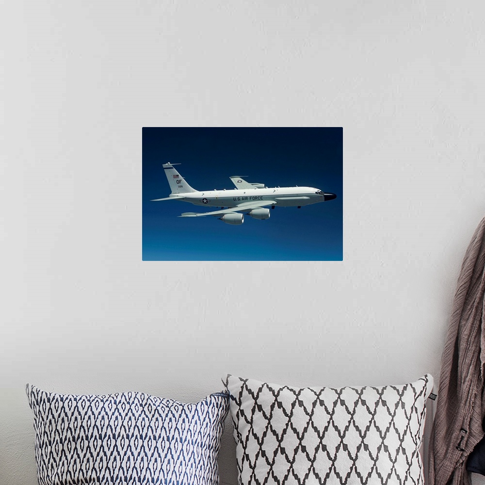 A bohemian room featuring An RC-135W Rivet Joint aircraft flies high over the Midwest on a training mission out of Offutt A...