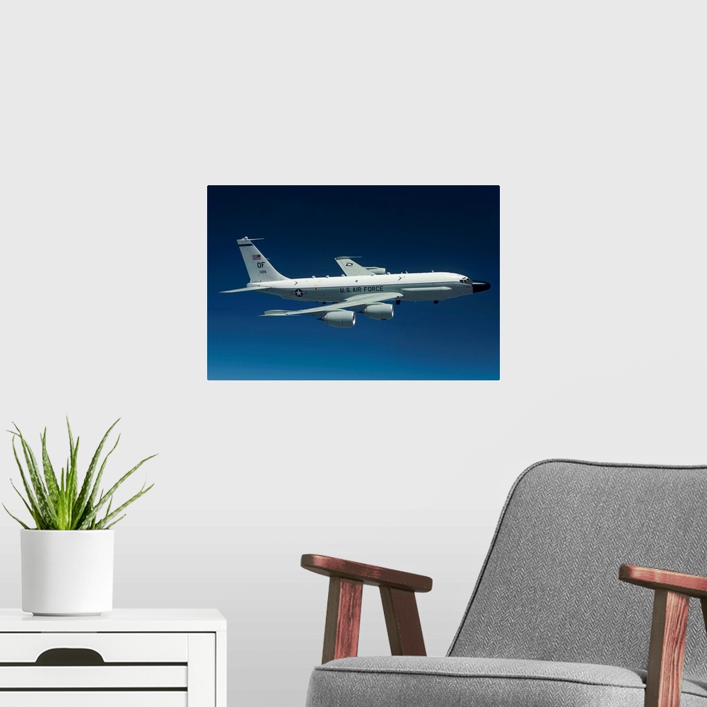 A modern room featuring An RC-135W Rivet Joint aircraft flies high over the Midwest on a training mission out of Offutt A...