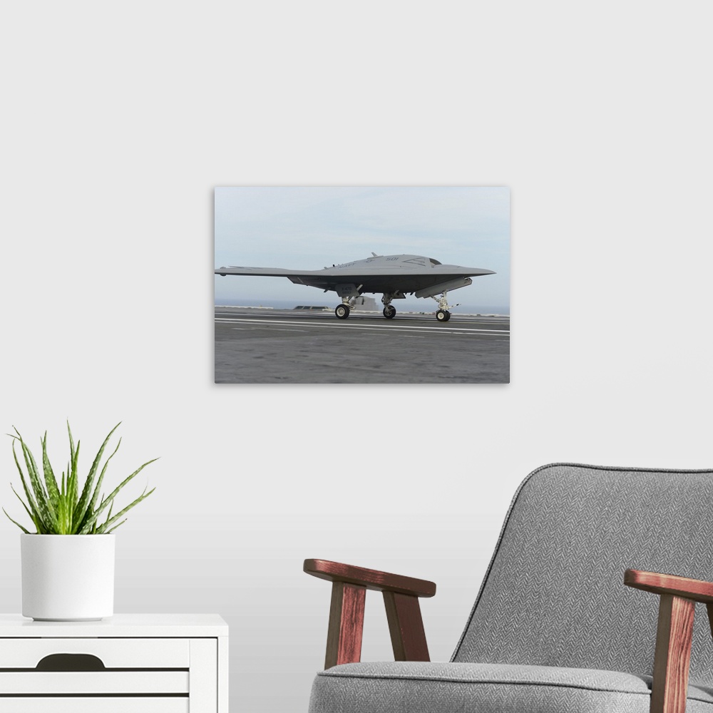 A modern room featuring Atlantic Ocean, May 21, 2013 - An X-47B Unmanned Combat Air System (UCAS) demonstrator conducts a...