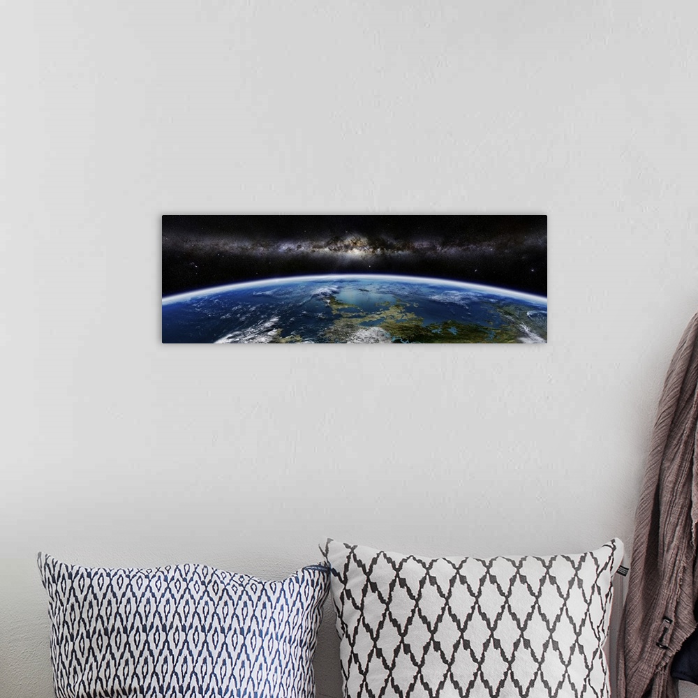 A bohemian room featuring Artist's concept of an extraterrestrial planet with a galaxy on the horizon.