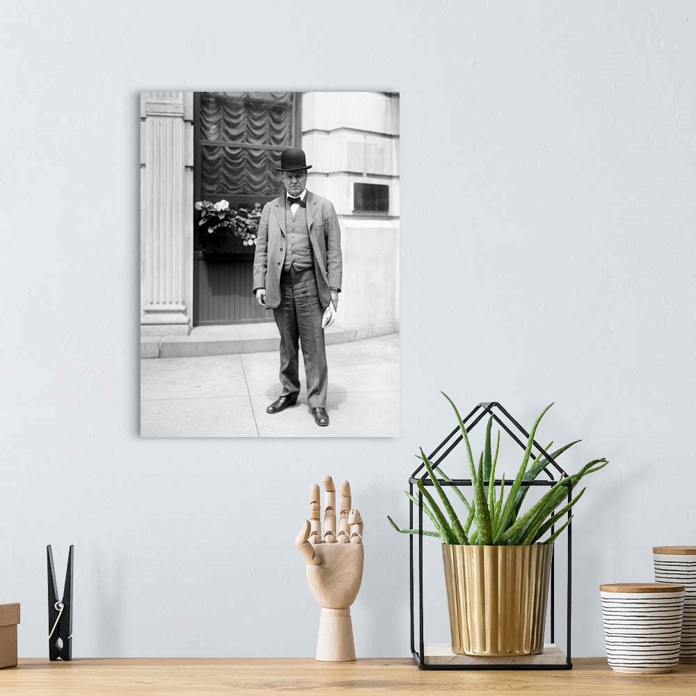 A bohemian room featuring American history photo of Attorney Clarence Darrow standing on the street.