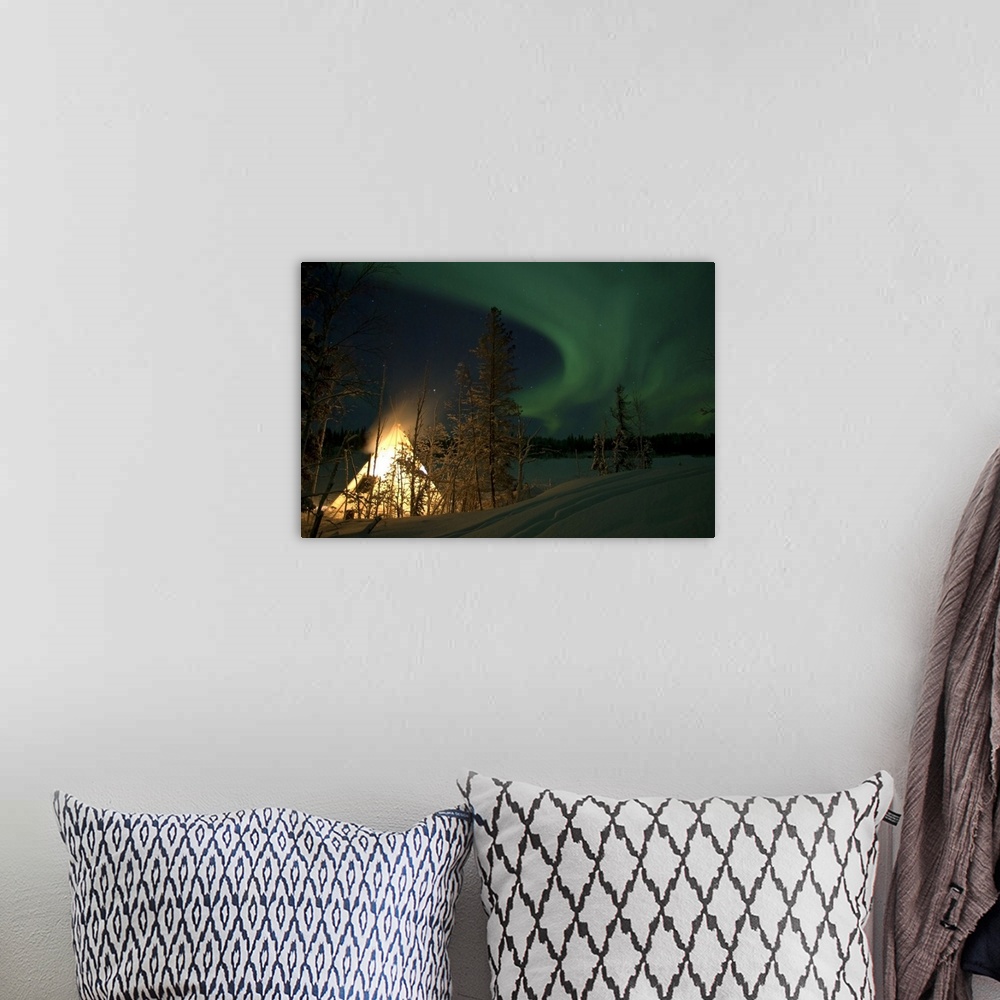 A bohemian room featuring Aurora above Aurora Village Aurora Lake Yellowknife Northwest Territories Canada