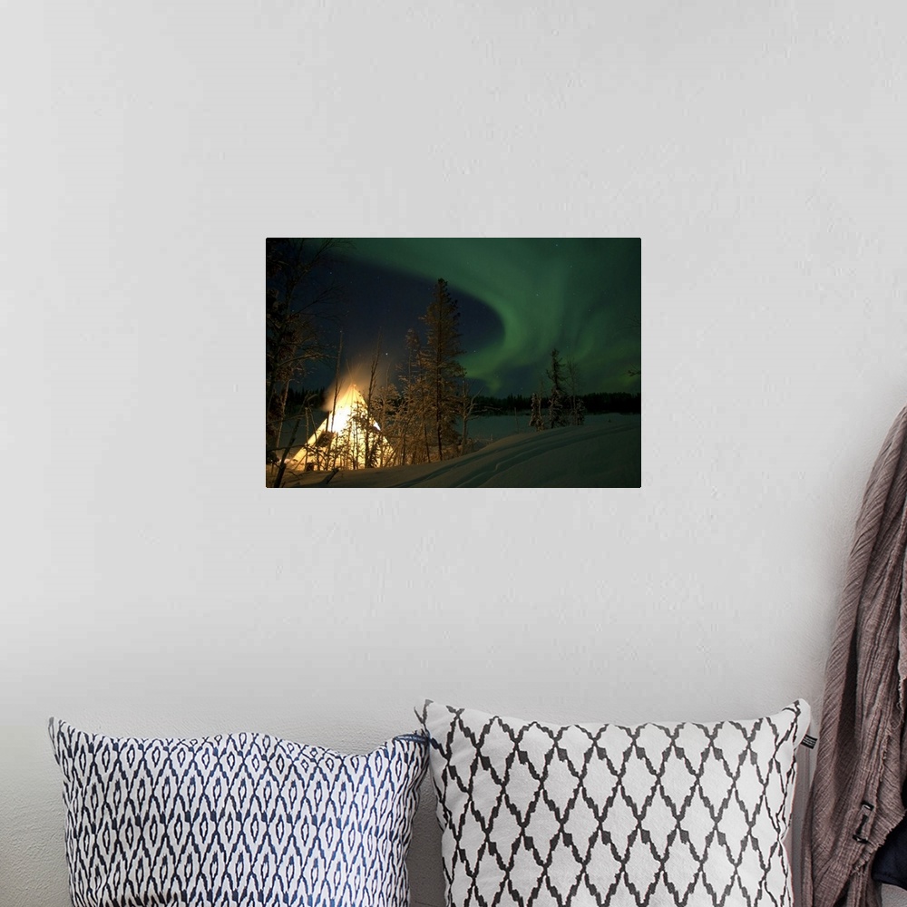 A bohemian room featuring Aurora above Aurora Village Aurora Lake Yellowknife Northwest Territories Canada