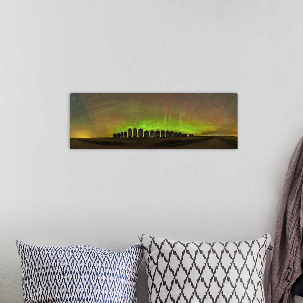 A bohemian room featuring A 180 degree panorama of a modest aurora display behind grain bins on a country road in Alberta, ...