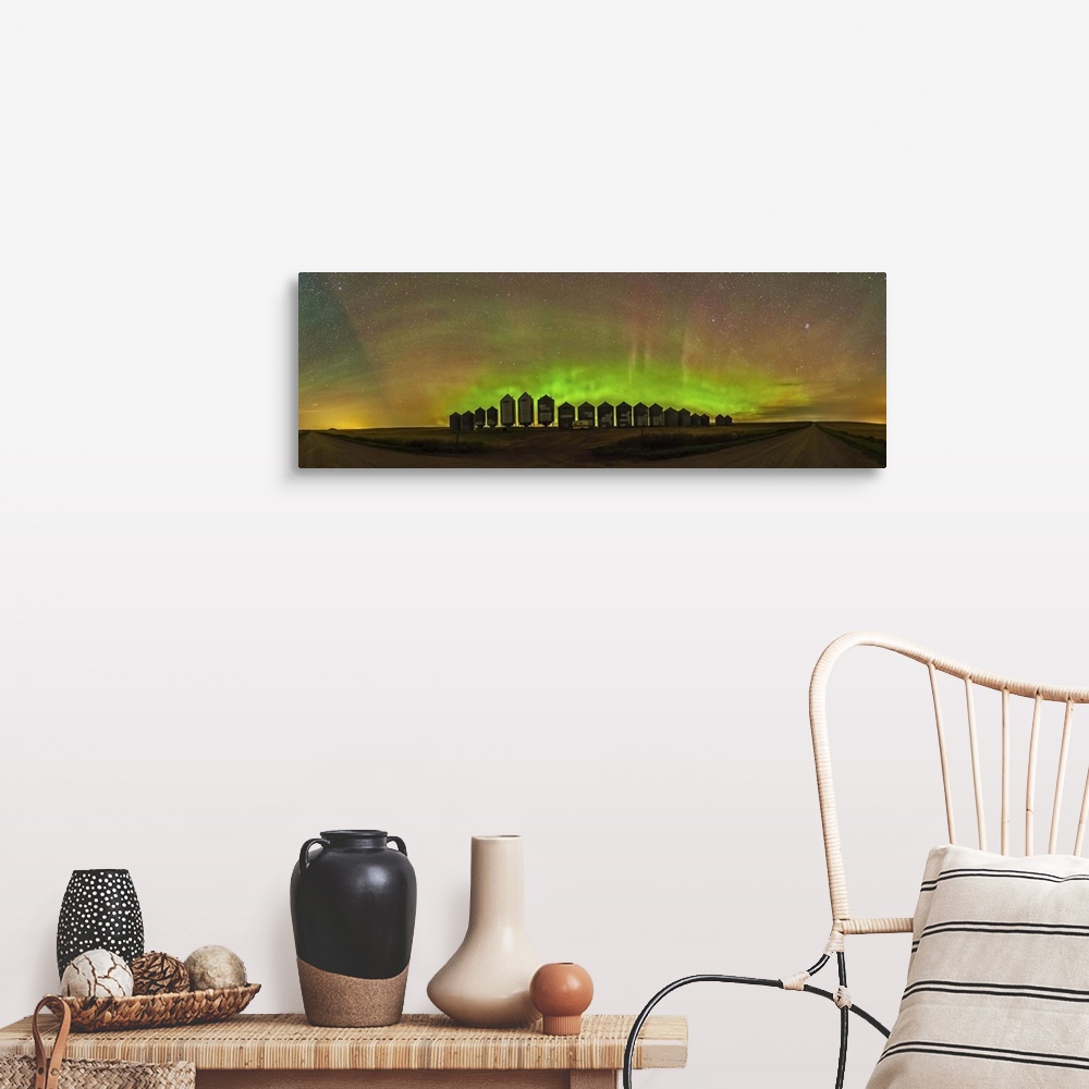 A farmhouse room featuring A 180 degree panorama of a modest aurora display behind grain bins on a country road in Alberta, ...