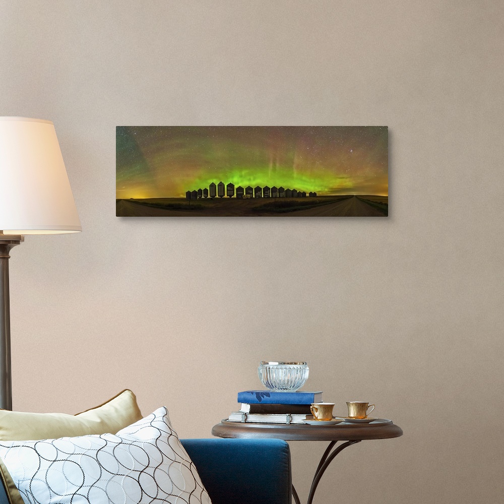 A traditional room featuring A 180 degree panorama of a modest aurora display behind grain bins on a country road in Alberta, ...