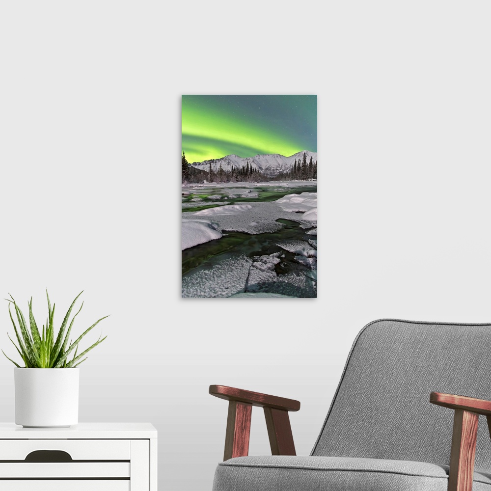 A modern room featuring Aurora borealis over Annie Lake, Yukon, Canada.
