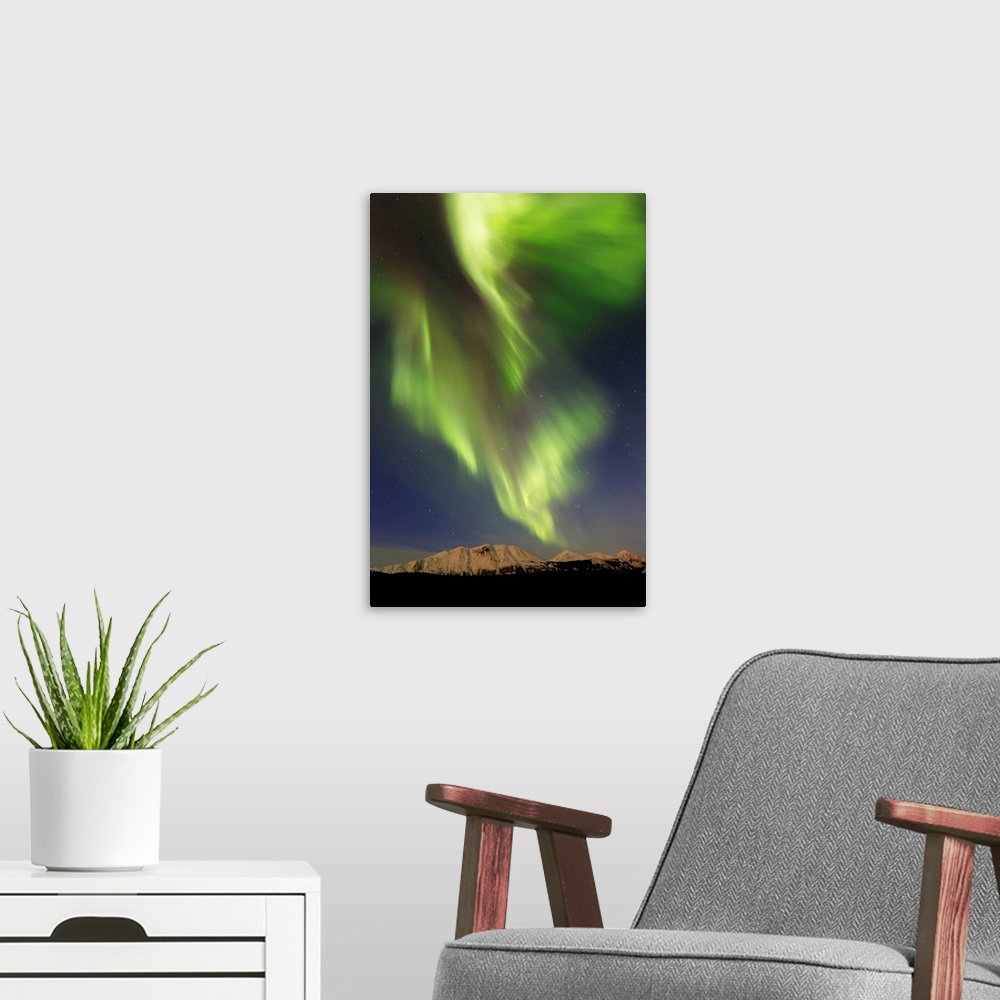 A modern room featuring Aurora borealis over Emerald Lake, Carcross, Yukon, Canada.