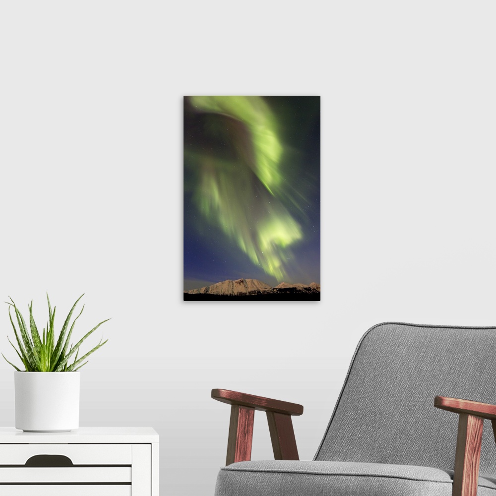 A modern room featuring Aurora borealis over Emerald Lake, Carcross, Yukon, Canada.