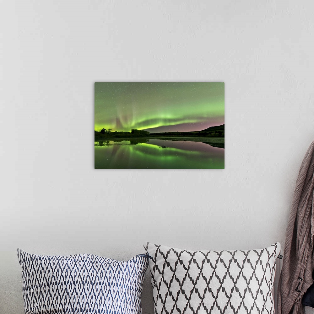 A bohemian room featuring Aurora borealis over Fish Lake, Whitehorse, Yukon, Canada.