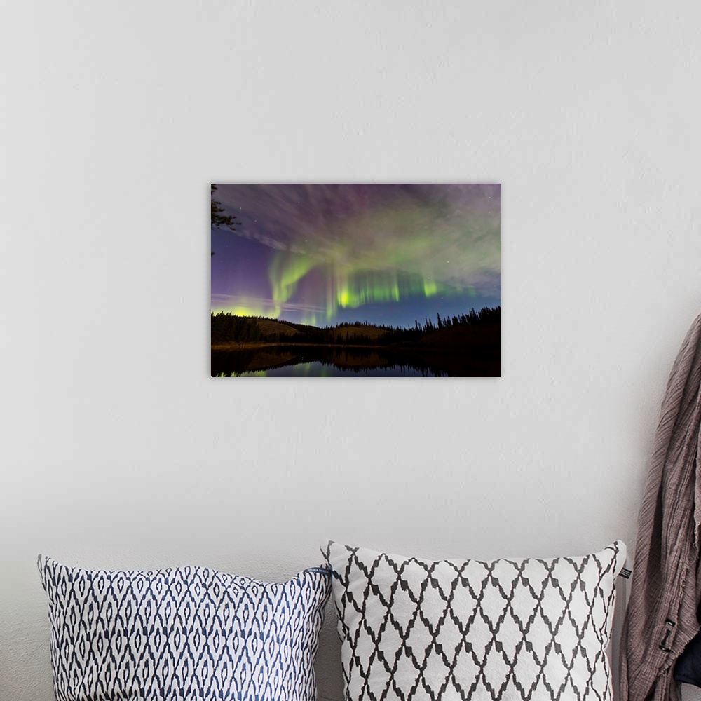 A bohemian room featuring Aurora borealis over Hidden Lake, Yukon, Canada.