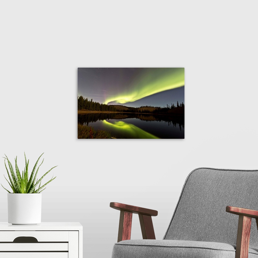 A modern room featuring Aurora borealis over Hidden Lake, Yukon, Canada.