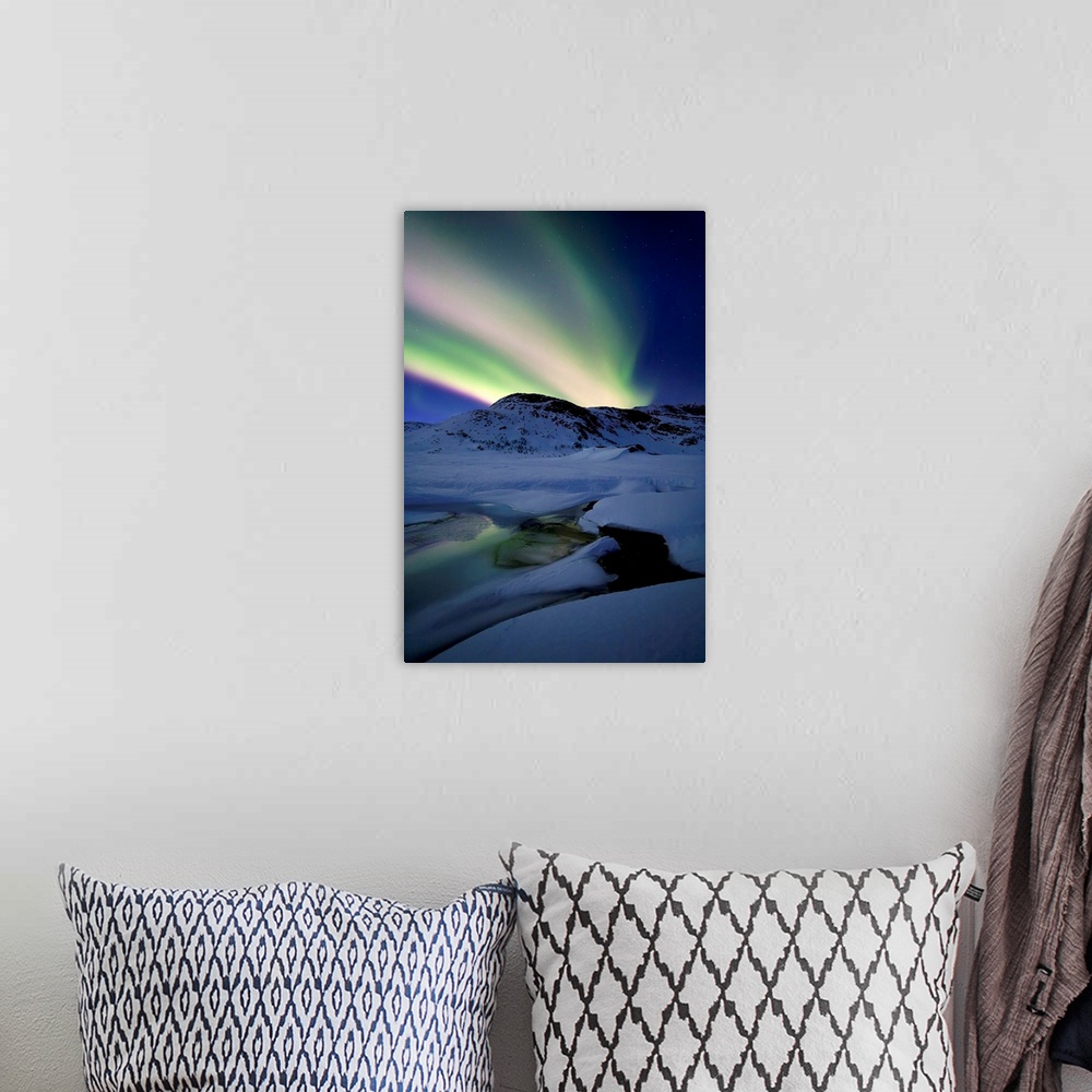 A bohemian room featuring Aurora Borealis over Mikkelfjellet Mountain in Troms County, Norway. Auroras are the result of th...